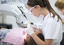 Dentist treating patient