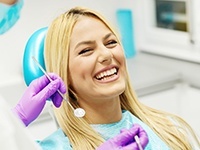 Laughing woman in dental chair