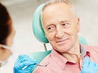 Smiling older man in dental chair