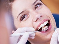 Woman receiving dental exam