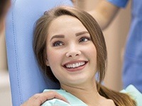 Young woman smiling in dental chair