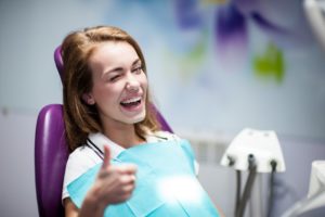 woman in dentist chair smiling