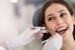 Woman getting a dental exam