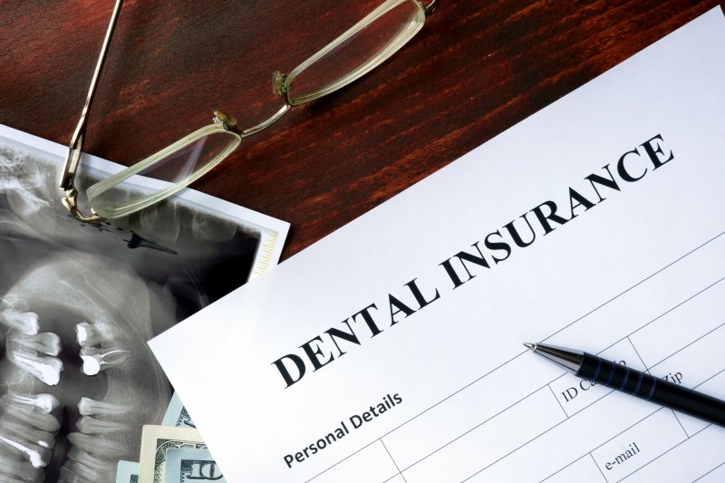 dental insurance form on wooden table