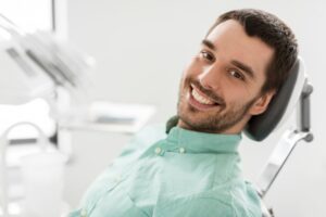 Man smiling after his dental cleaning